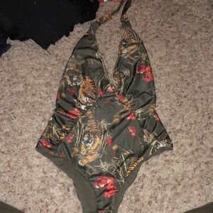 Green jungle one piece suit